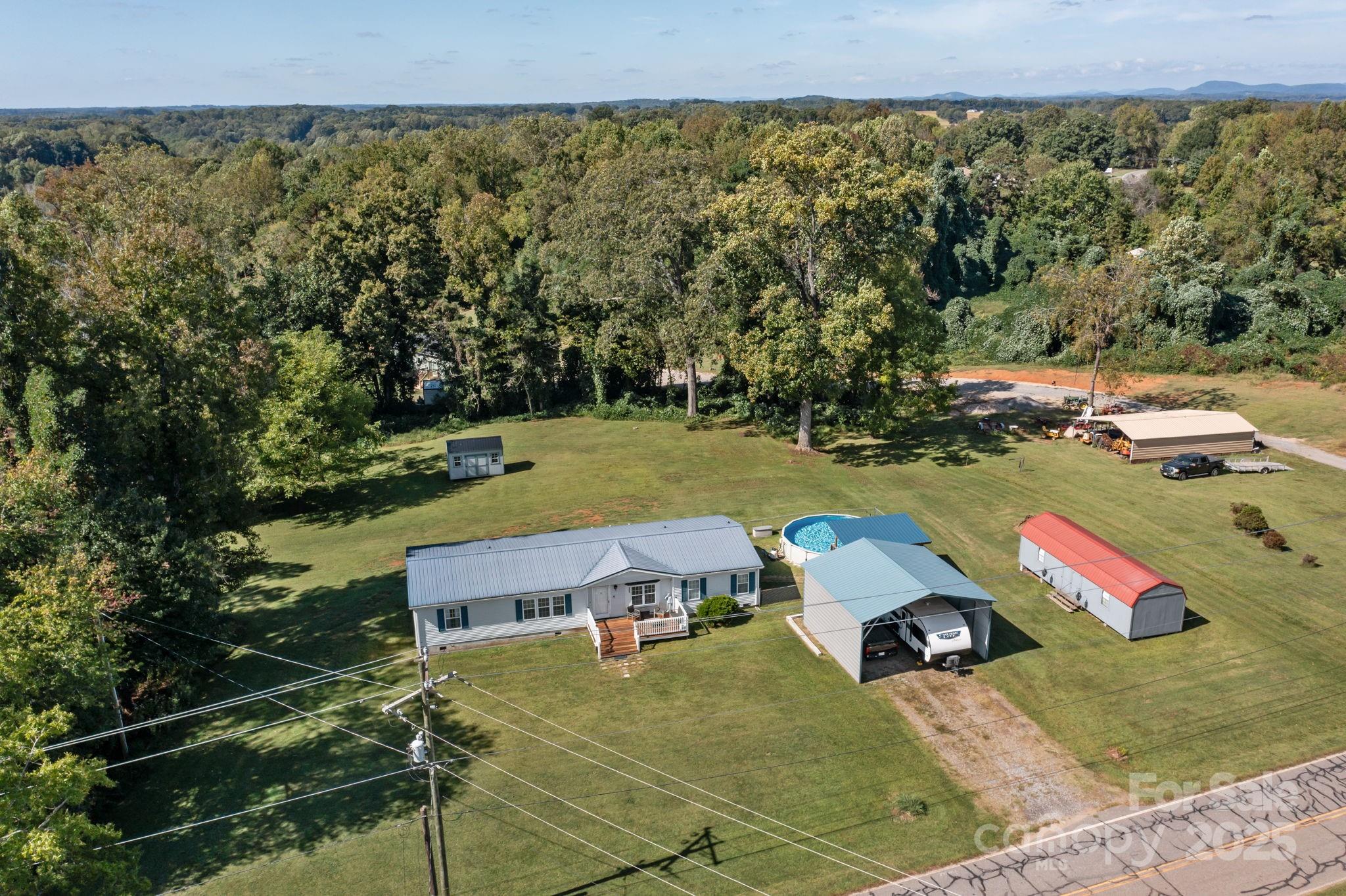 555 Fairmount Road Statesville, NC 28625 - Photo 48 of 48 a view of a yard with an outdoor space