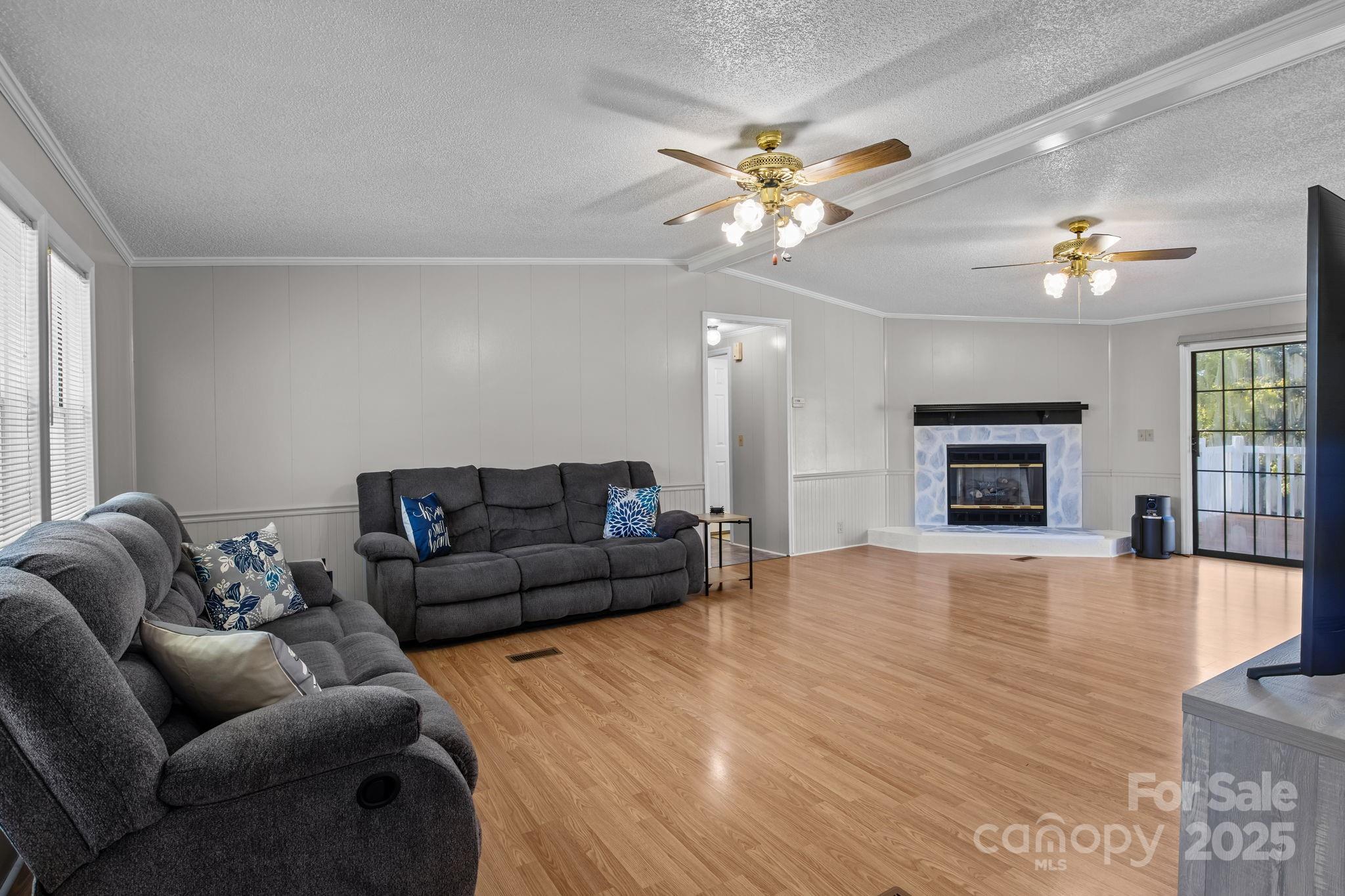 555 Fairmount Road Statesville, NC 28625 - Photo 9 of 48 a living room with furniture and a fireplace