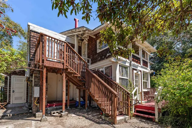 a view of street with wooden fence