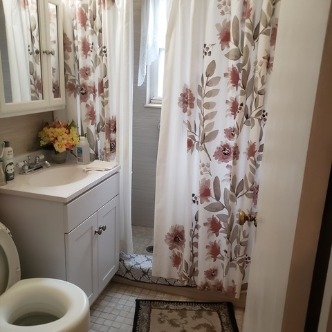 2724 West Gregory Street, Unit 2 Chicago, IL 60625 - Photo 13 of 15 a bathroom with a sink toilet and shower