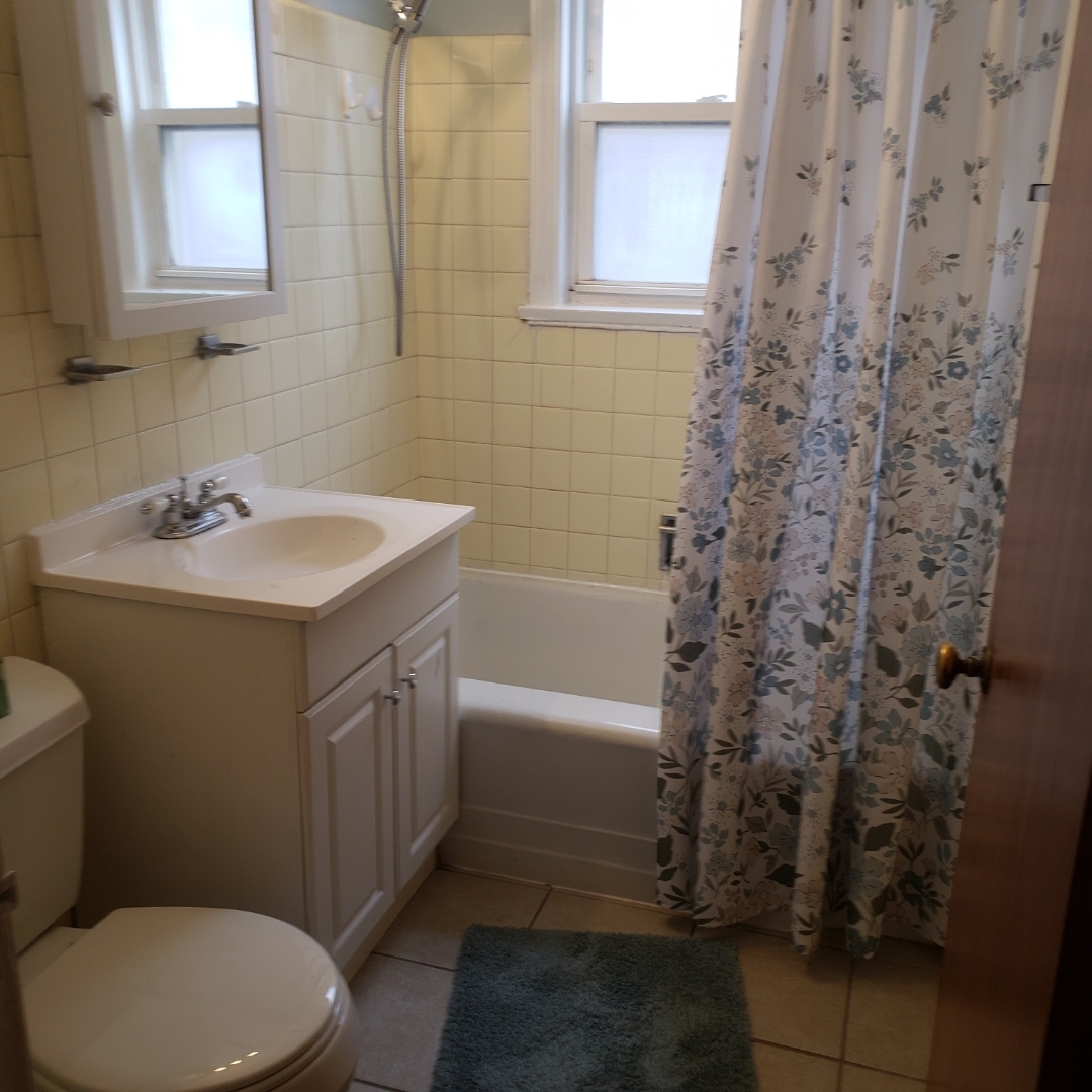 2724 West Gregory Street, Unit 2 Chicago, IL 60625 - Photo 14 of 15 a bathroom with a sink a toilet and shower