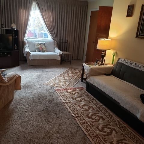 2724 West Gregory Street, Unit 2 Chicago, IL 60625 - Photo 3 of 15 a living room with furniture and a flat screen tv