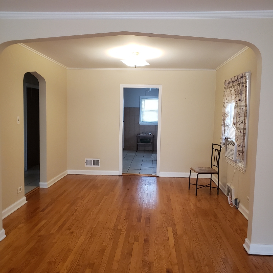 2724 West Gregory Street, Unit 2 Chicago, IL 60625 - Photo 6 of 15 a view of a room with wooden floor and furniture