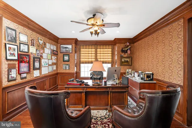 a living room with furniture fireplace and window
