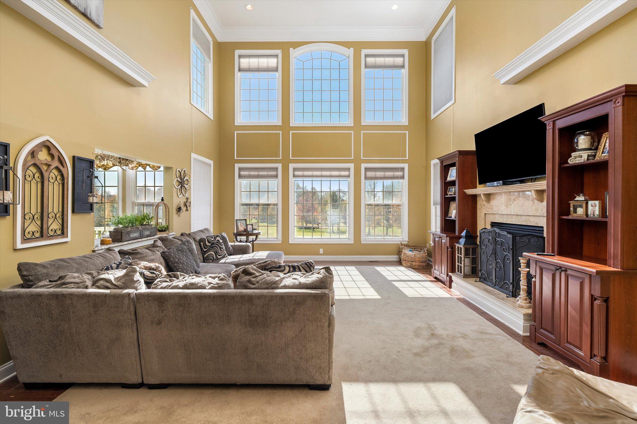 30 Ridgeview Way Allentown, NJ 08501 - Photo 20 of 57 a living room with furniture flat screen tv and a large window