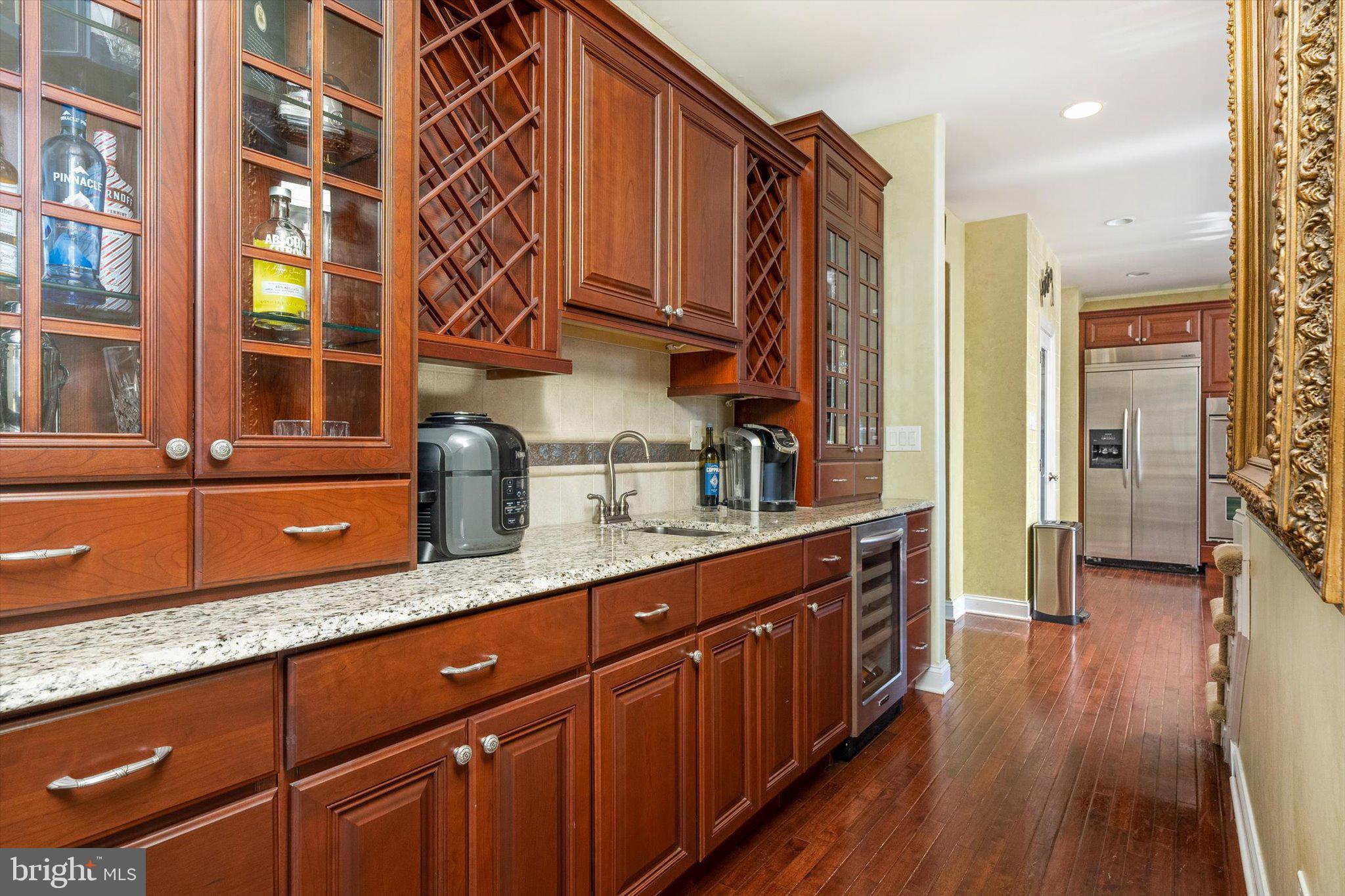 30 Ridgeview Way Allentown, NJ 08501 - Photo 21 of 57 a kitchen with stainless steel appliances granite countertop a sink and wooden cabinets