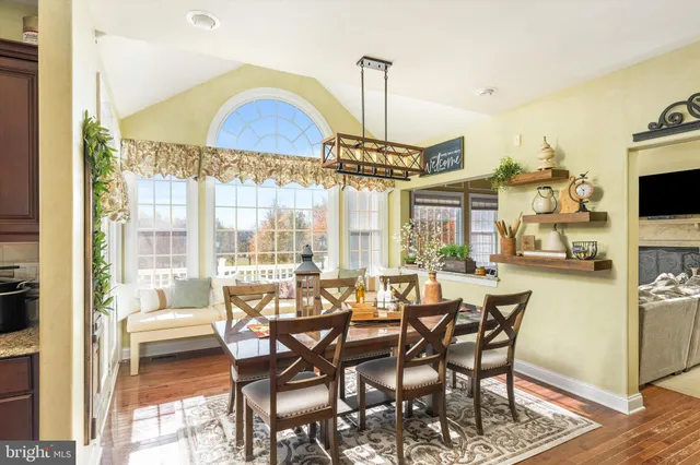 an entryway with a dining room and livingroom