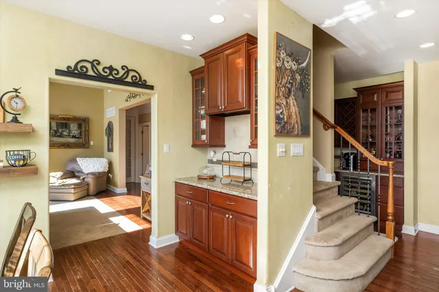 a kitchen with a sink cabinets and a stove top oven