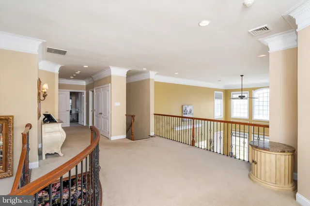 a spacious bedroom with a bed and a desk