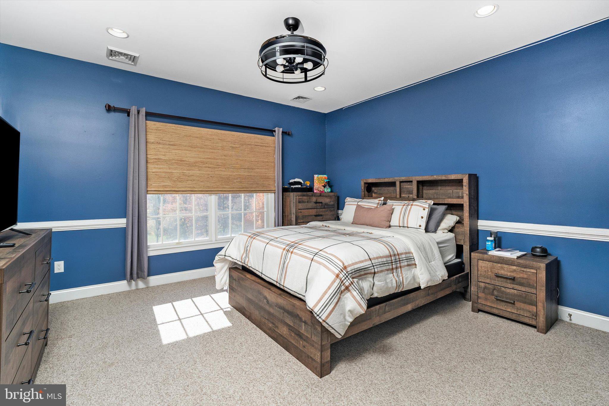 30 Ridgeview Way Allentown, NJ 08501 - Photo 34 of 57 a spacious bedroom with a bed and a desk