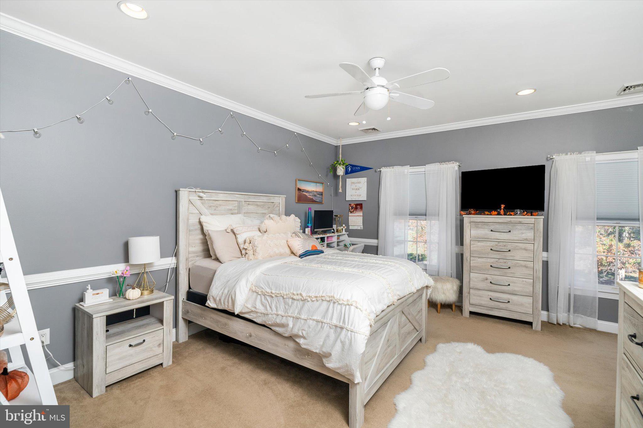 30 Ridgeview Way Allentown, NJ 08501 - Photo 37 of 57 a bedroom with a bed and a flat screen tv