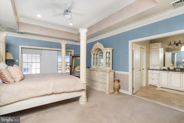 a bathroom with a granite countertop toilet sink and mirror