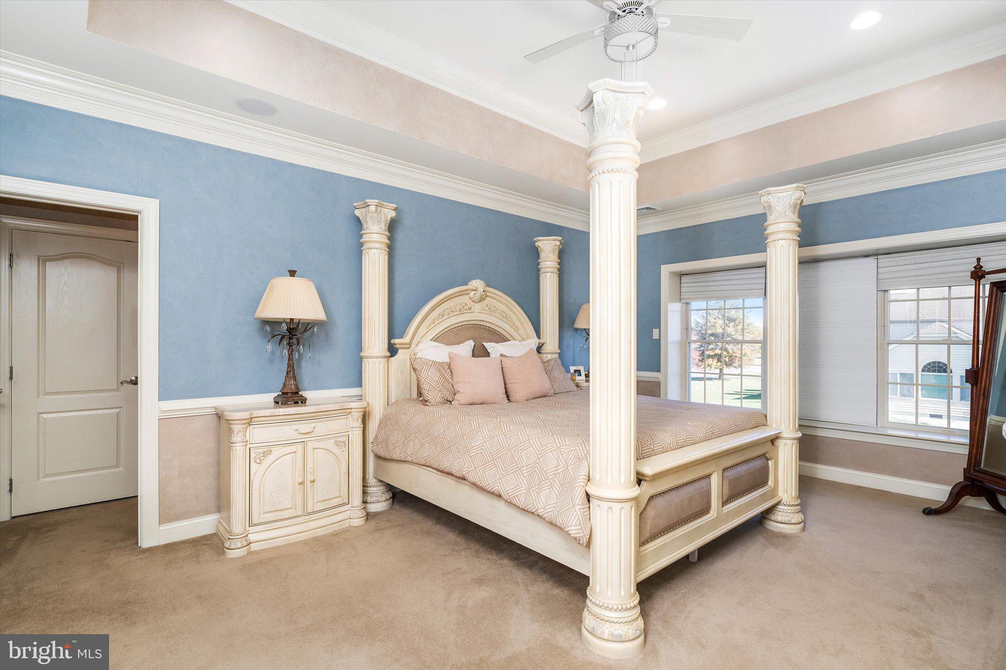 30 Ridgeview Way Allentown, NJ 08501 - Photo 42 of 57 a spacious bedroom with a bed and a table lamp