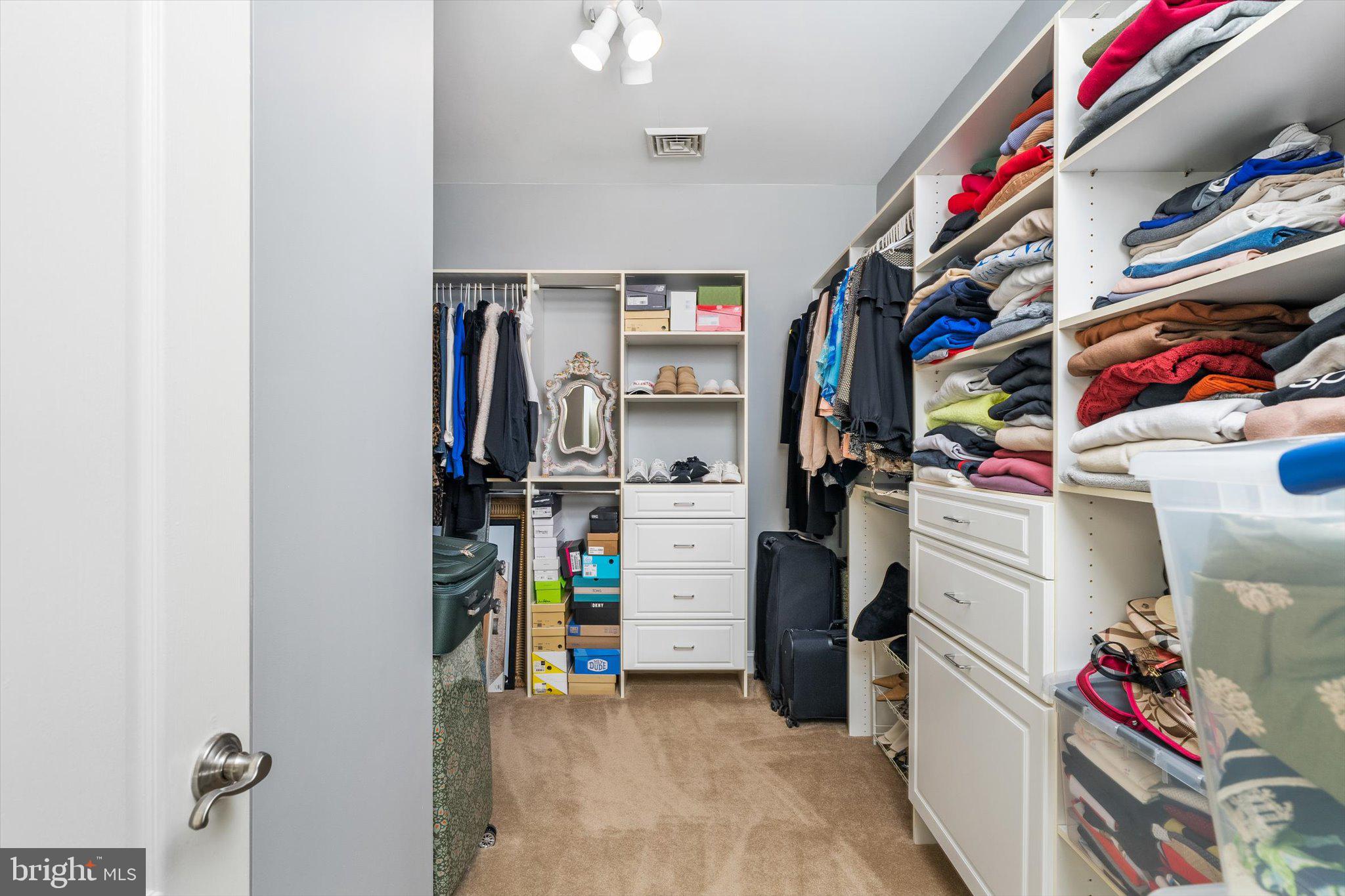 30 Ridgeview Way Allentown, NJ 08501 - Photo 45 of 57 a view of walk in closet with clothes and shoes