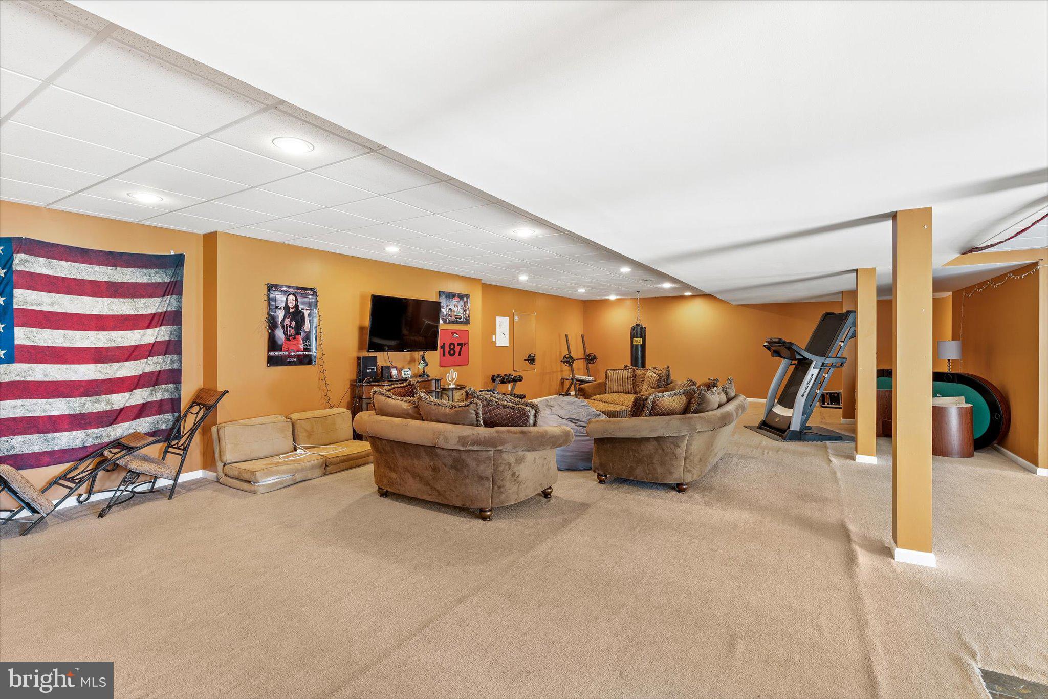 30 Ridgeview Way Allentown, NJ 08501 - Photo 48 of 57 a living room with furniture and a flat screen tv
