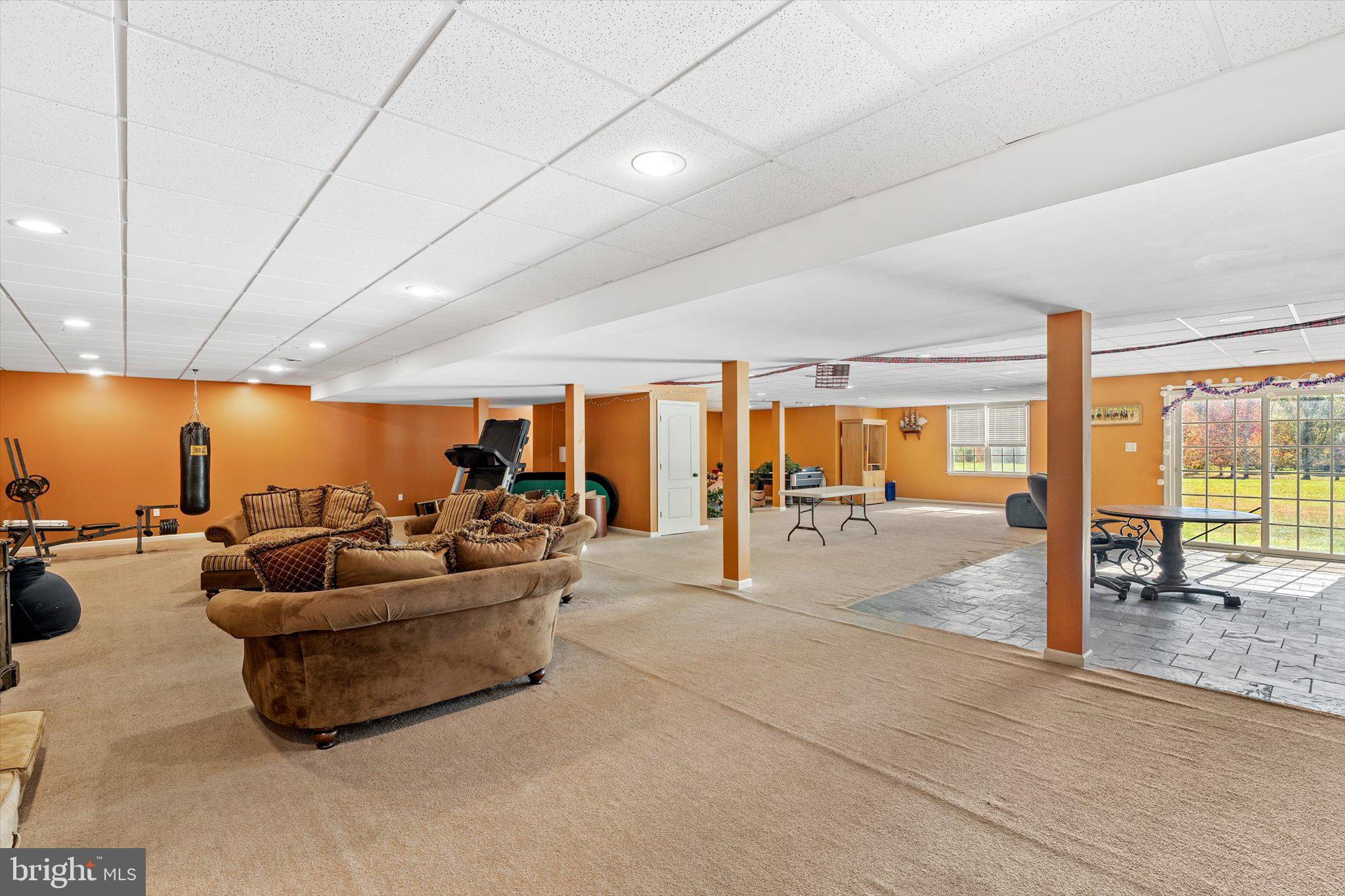 30 Ridgeview Way Allentown, NJ 08501 - Photo 49 of 57 a living room with furniture and a floor to ceiling window