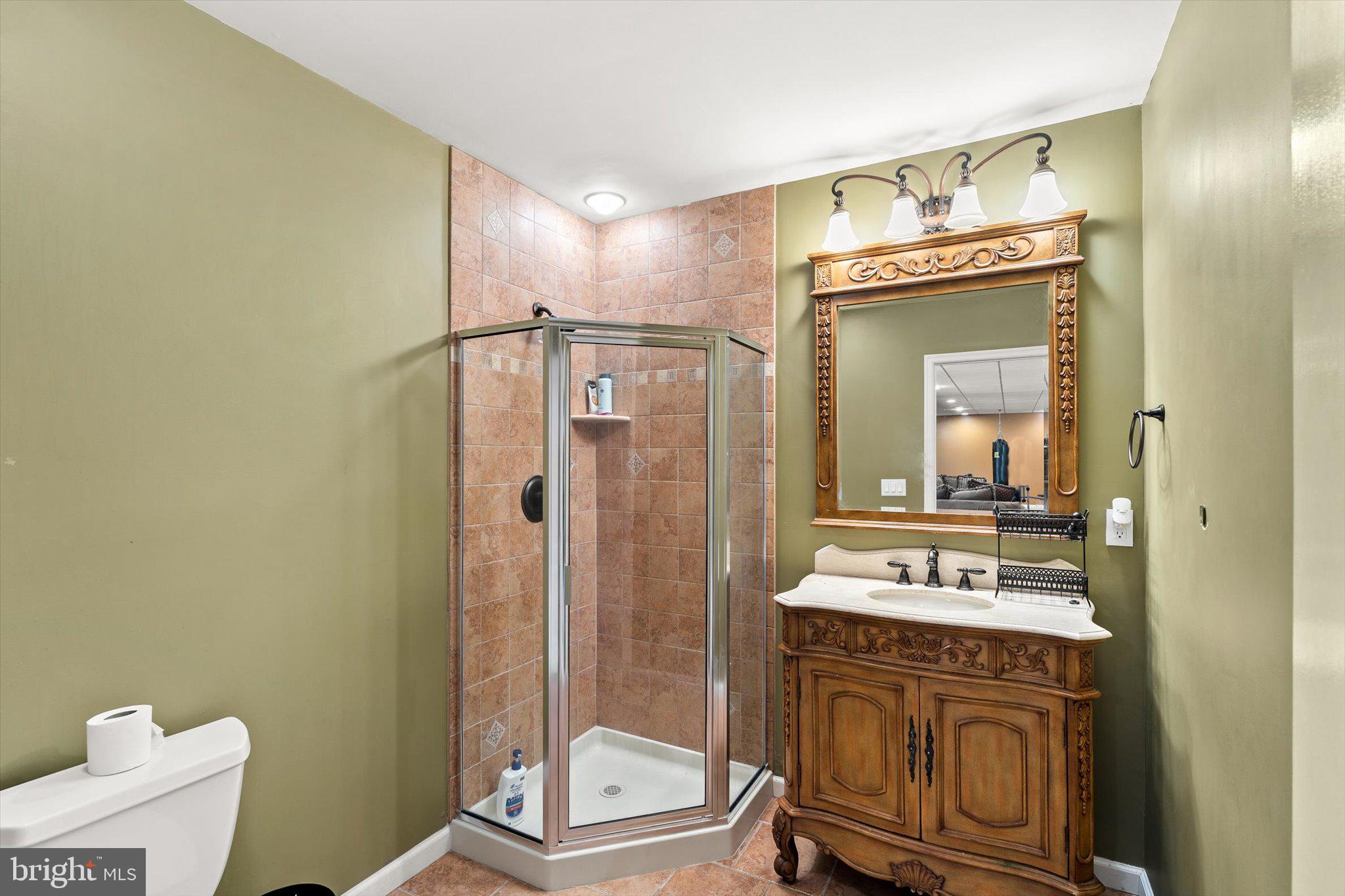 30 Ridgeview Way Allentown, NJ 08501 - Photo 50 of 57 a bathroom with a sink a toilet and shower