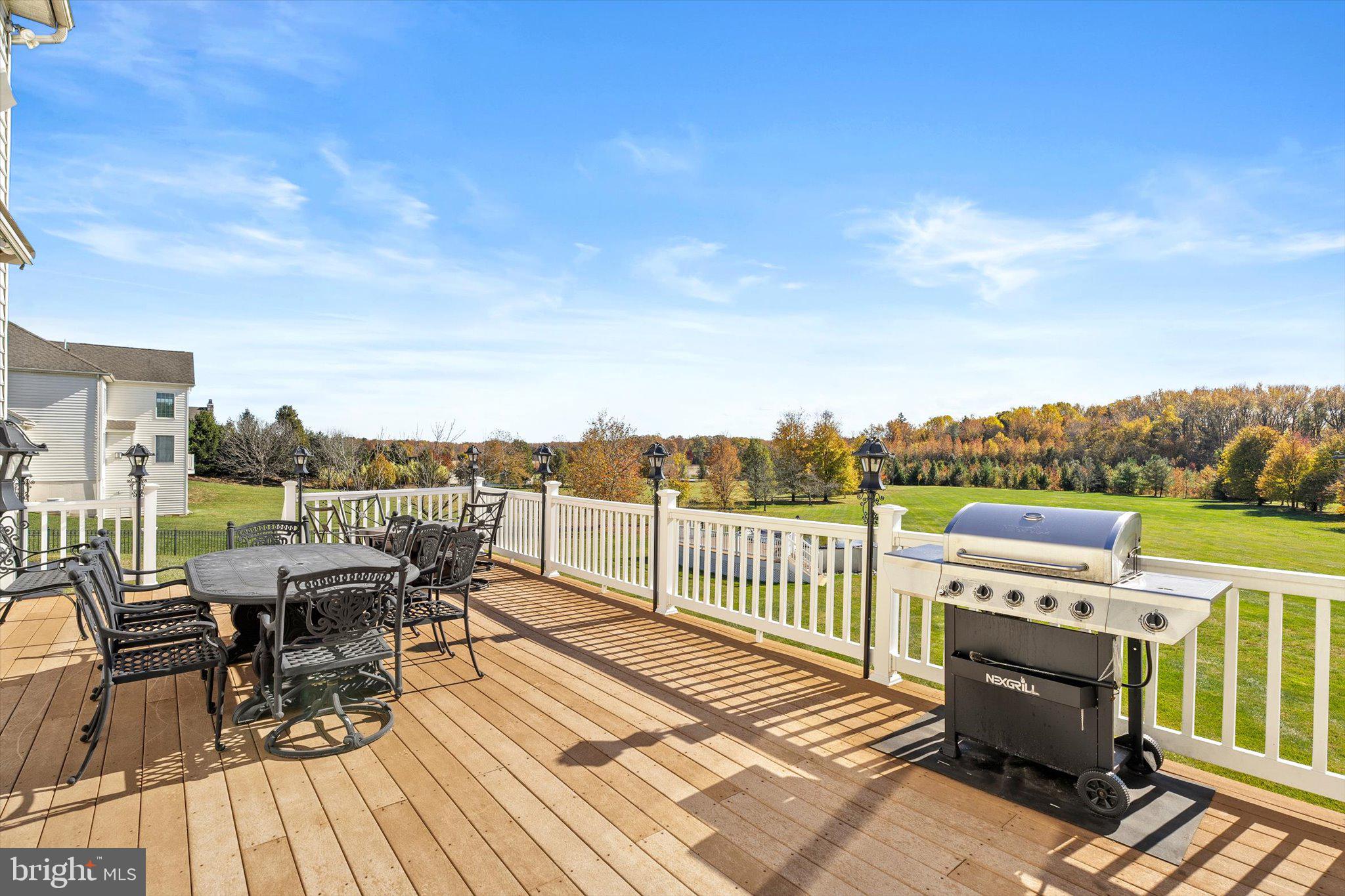 30 Ridgeview Way Allentown, NJ 08501 - Photo 51 of 57 a view of a balcony with chairs and wooden floor