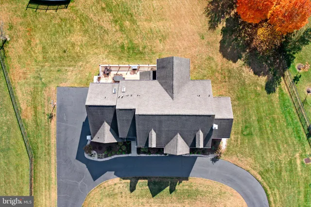 a view of a balcony with two chairs and a table