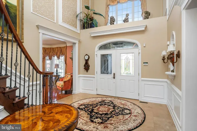 a view of a livingroom with furniture and staircase