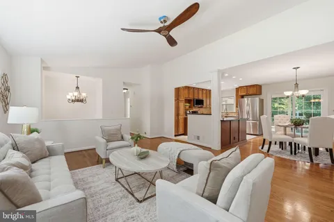 a living room with furniture or kitchen and a wooden floor