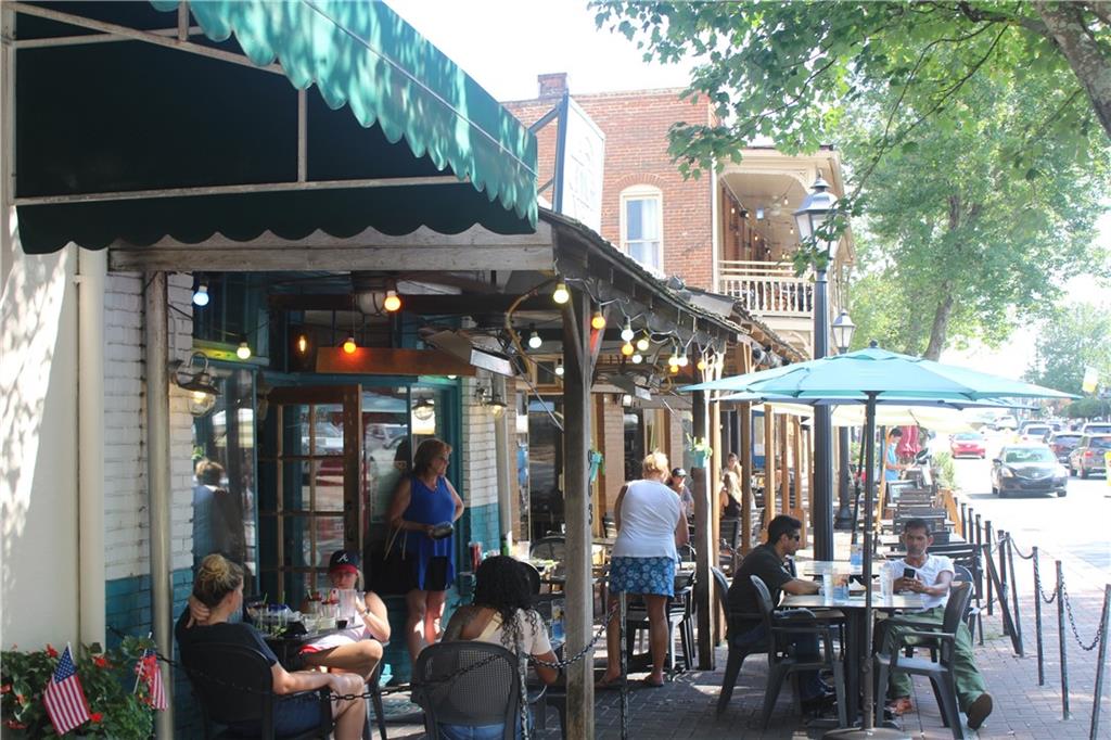 69 Maple Street Roswell, GA 30075 - Photo 16 of 22 a view of street with sitting area
