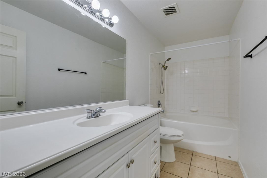 7570 West Flamingo Road, Unit 252 Las Vegas, NV 89147 - Photo 35 of 44 A well-lit primary bathroom featuring a single vanity and a shower-tub combination.