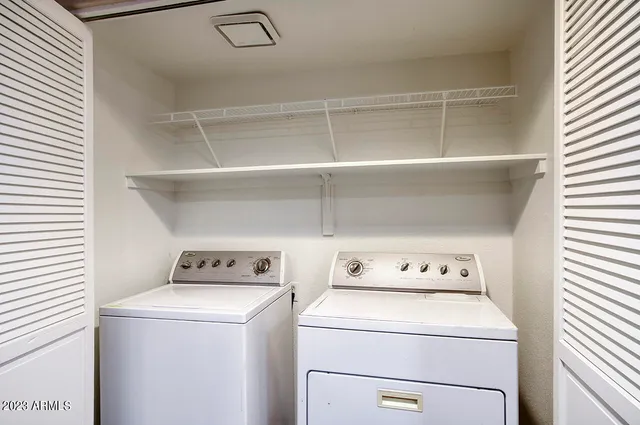 a utility room with dryer and washer
