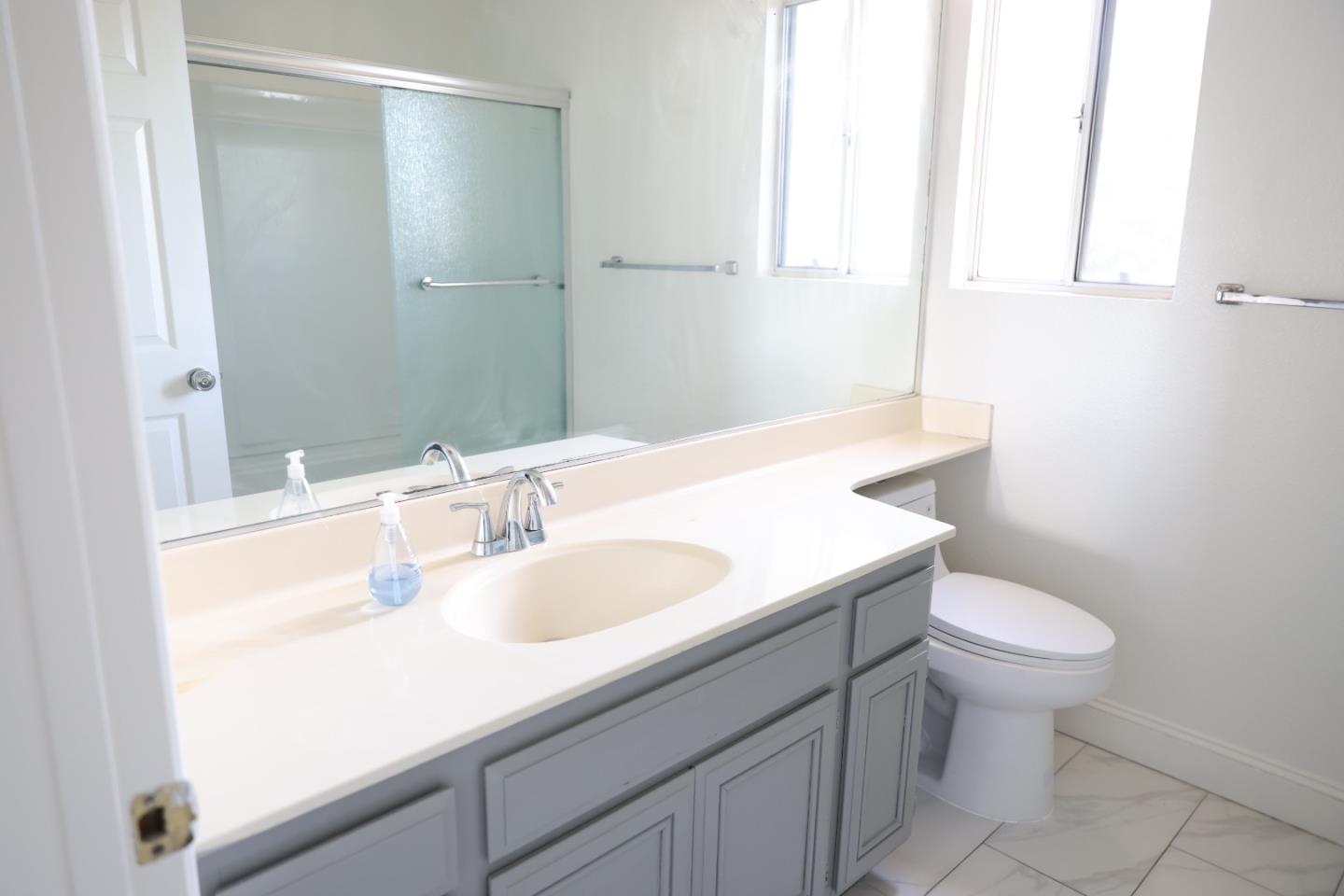 5012 Rodeo Circle Antioch, CA 94531 - Photo 30 of 36 a bathroom with a sink toilet and a mirror