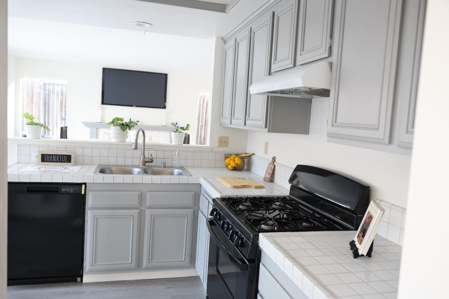 5012 Rodeo Circle Antioch, CA 94531 - Photo 8 of 36 a kitchen with sink stove and cabinets