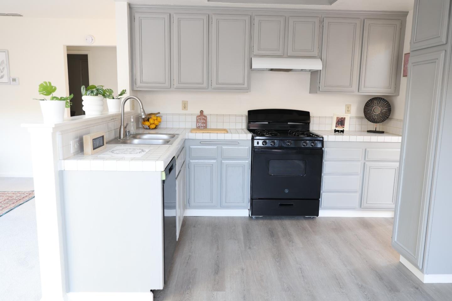 5012 Rodeo Circle Antioch, CA 94531 - Photo 10 of 36 a kitchen with a stove a sink and a cabinets