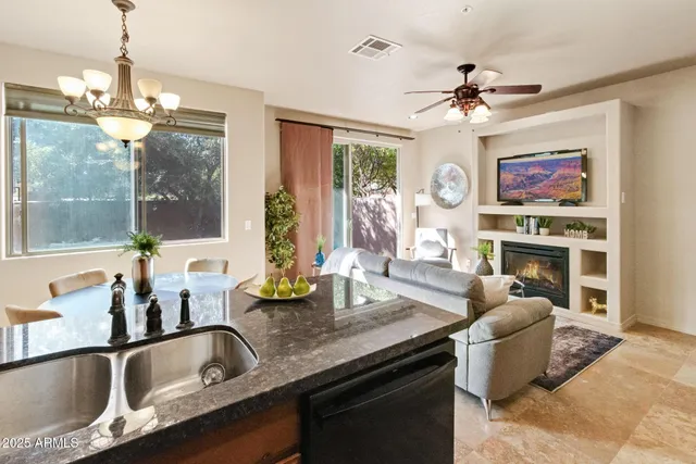 a kitchen with a sink a stove and a microwave