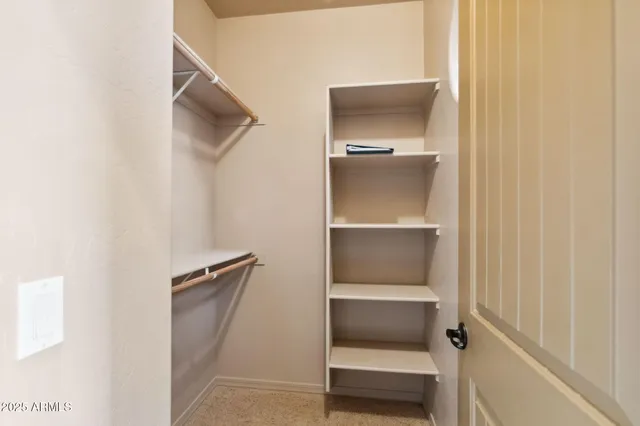 a bathroom with double vanity sinks and a mirror
