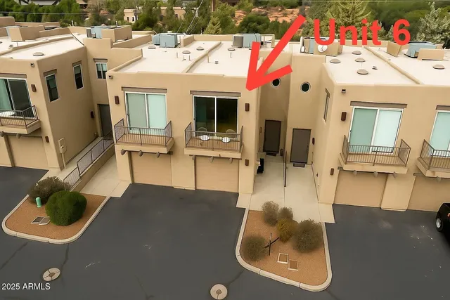 a view of a patio with table and chairs