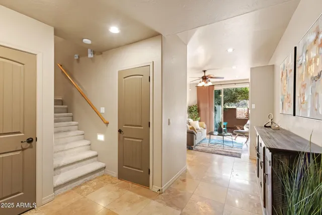 a view of a hallway with furniture and entryway
