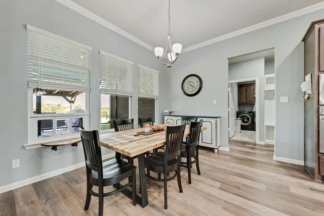 a view of a dining table and a clock on a table