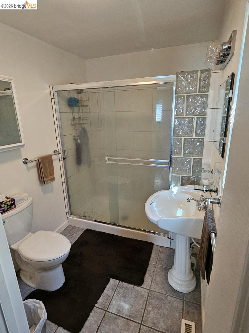 19967 Peaceful Oak Road Sonora, CA 95370 - Photo 14 of 35 Bathroom with a shower stall and light tile patterned floors