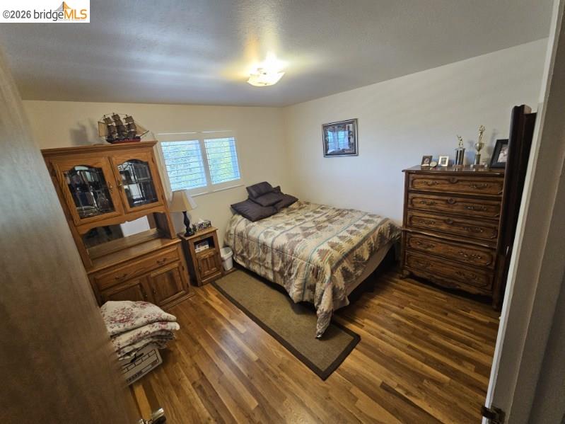 19967 Peaceful Oak Road Sonora, CA 95370 - Photo 15 of 35 Bedroom featuring dark wood-type flooring