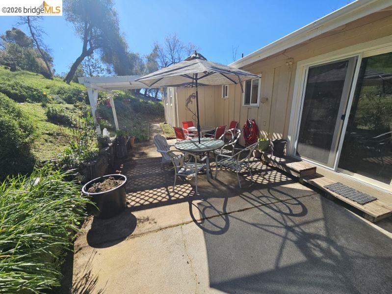 19967 Peaceful Oak Road Sonora, CA 95370 - Photo 21 of 35 View of patio with outdoor dining space