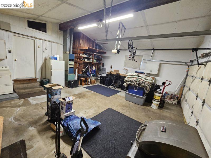 19967 Peaceful Oak Road Sonora, CA 95370 - Photo 34 of 35 Garage featuring washer / dryer and freestanding refrigerator