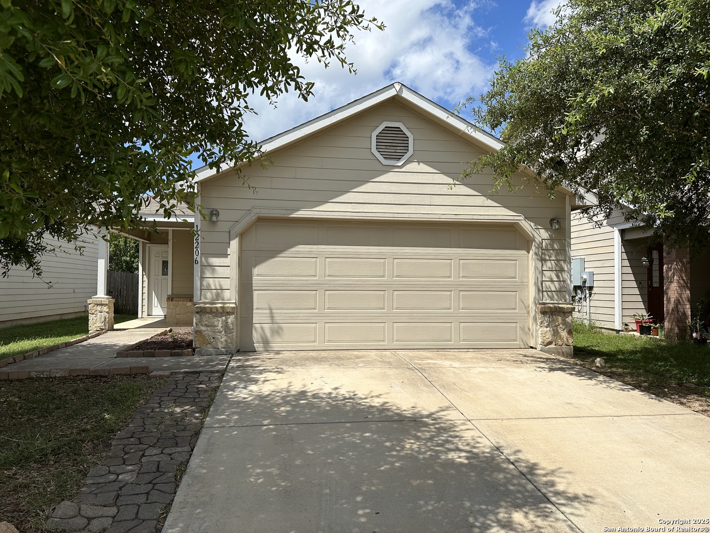 12206 Mountain Pine San Antonio, TX 78254 - Photo 1 of 1 a front view of a house with a yard and garage