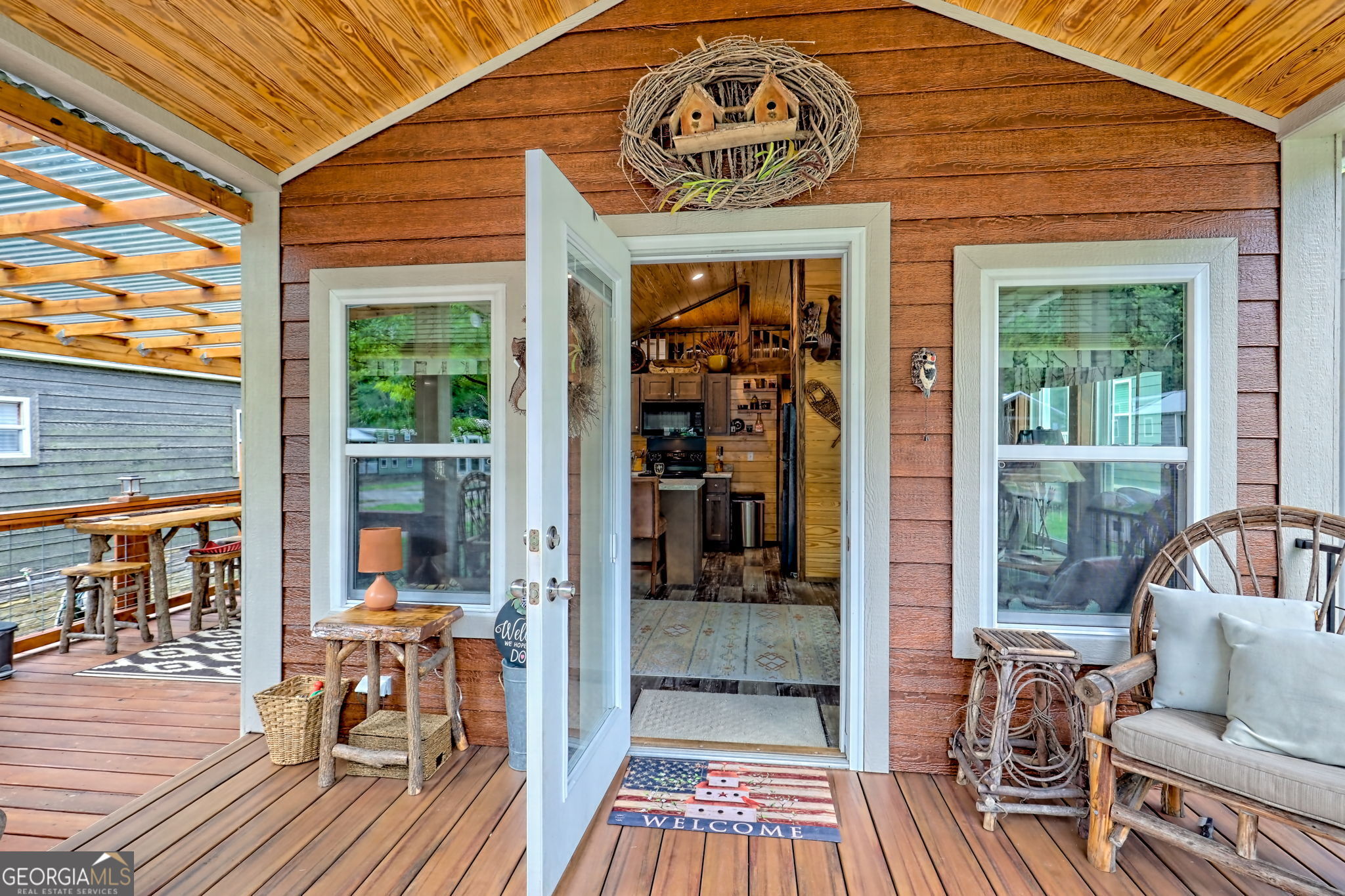 4960 Laurel Lodge Road, Unit 18 Clarkesville, GA 30523 - Photo 12 of 59 a view of a dinning tables and chairs in the balcony