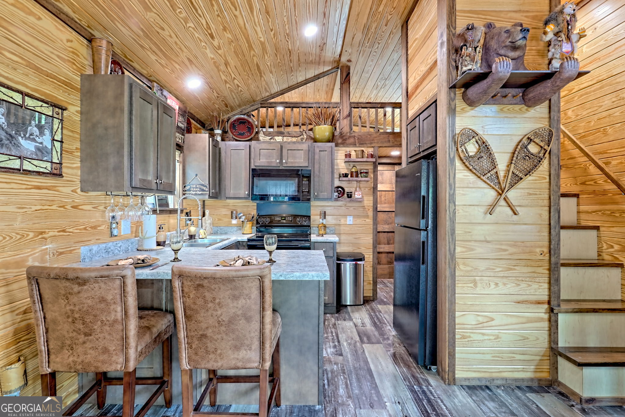 4960 Laurel Lodge Road, Unit 18 Clarkesville, GA 30523 - Photo 15 of 59 a kitchen with stainless steel appliances kitchen island granite countertop a sink and cabinets