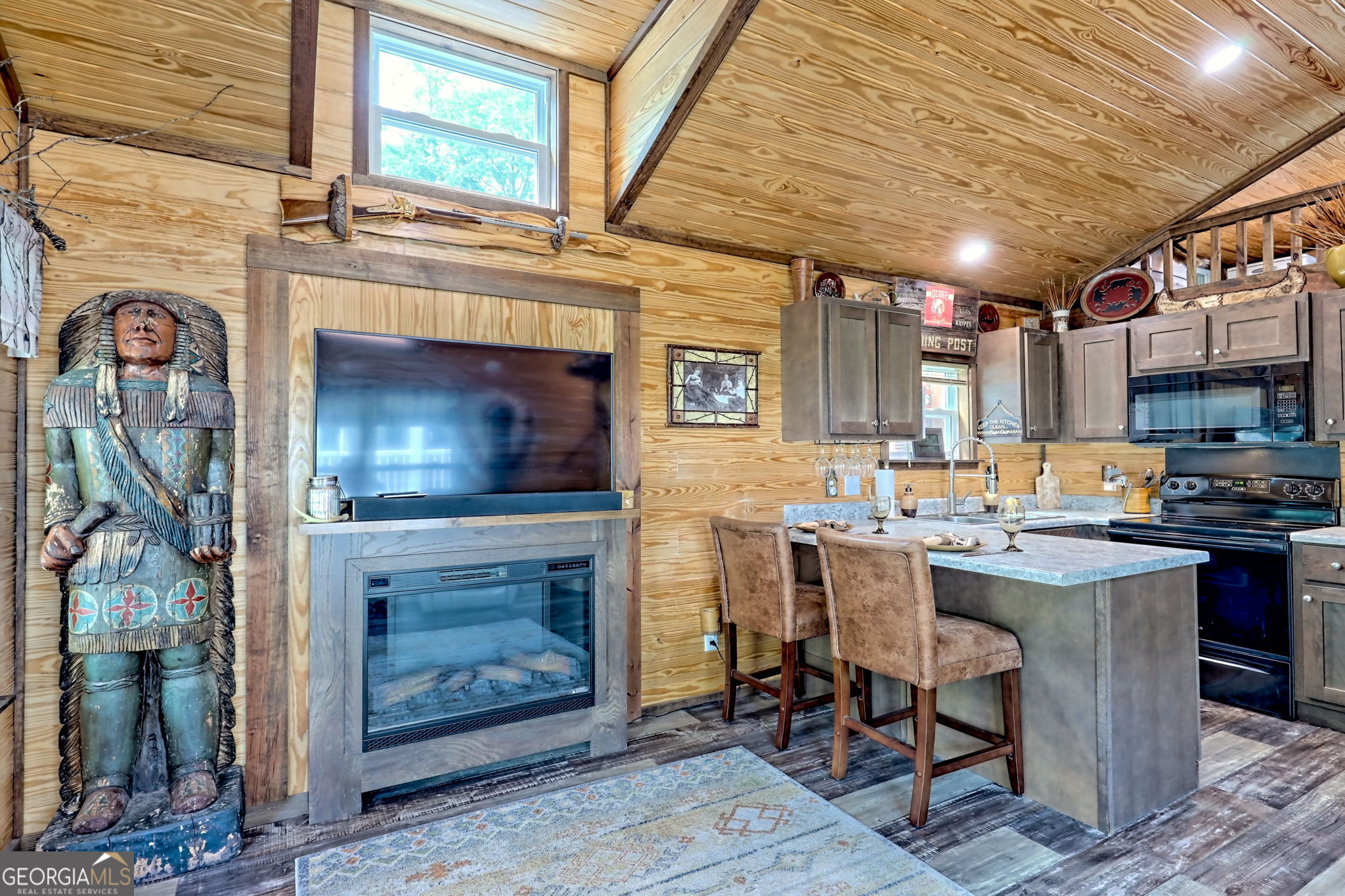 4960 Laurel Lodge Road, Unit 18 Clarkesville, GA 30523 - Photo 16 of 59 a open kitchen with a sink a stove and a wooden floors