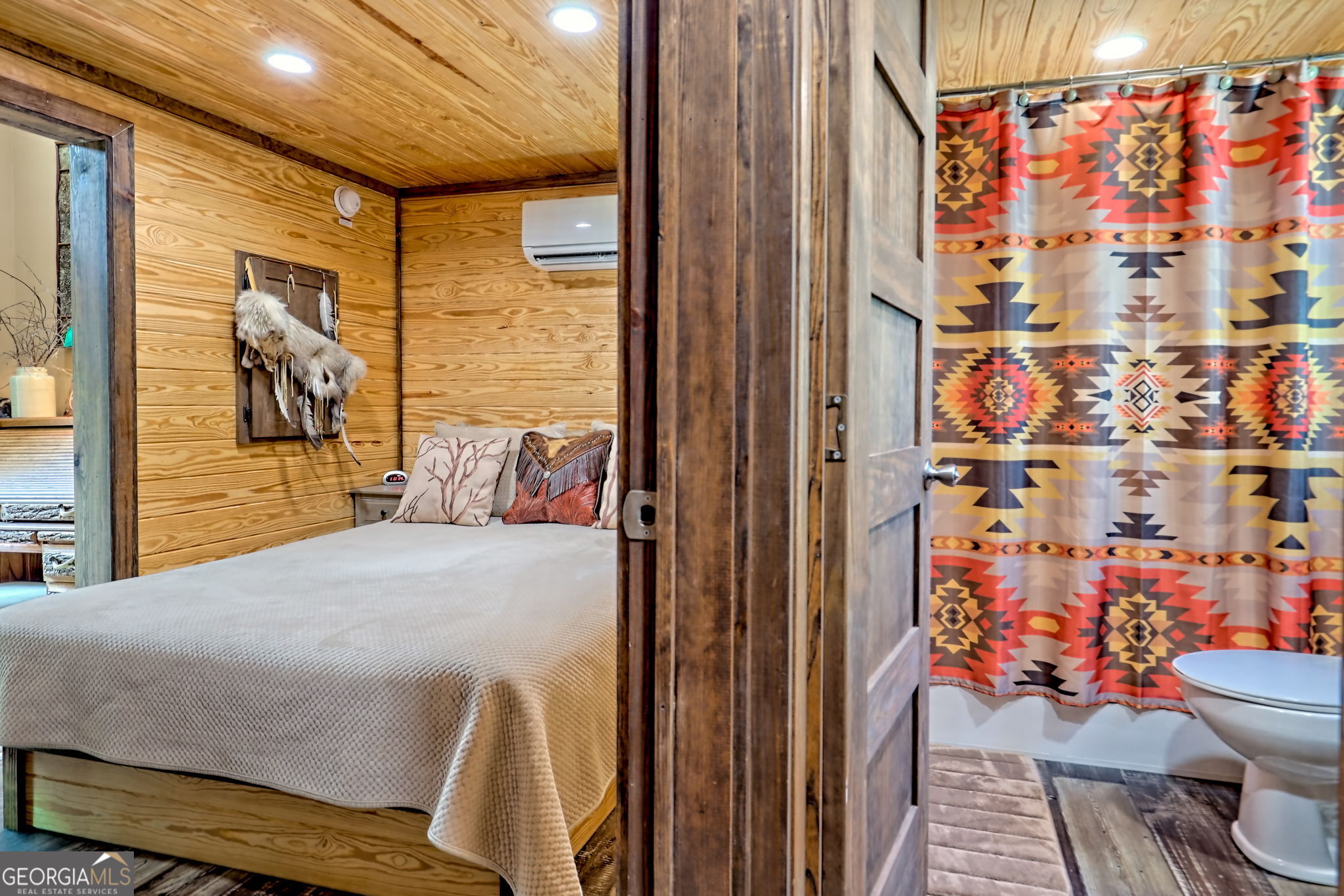 4960 Laurel Lodge Road, Unit 18 Clarkesville, GA 30523 - Photo 21 of 59 a bed room with a bed and a couch