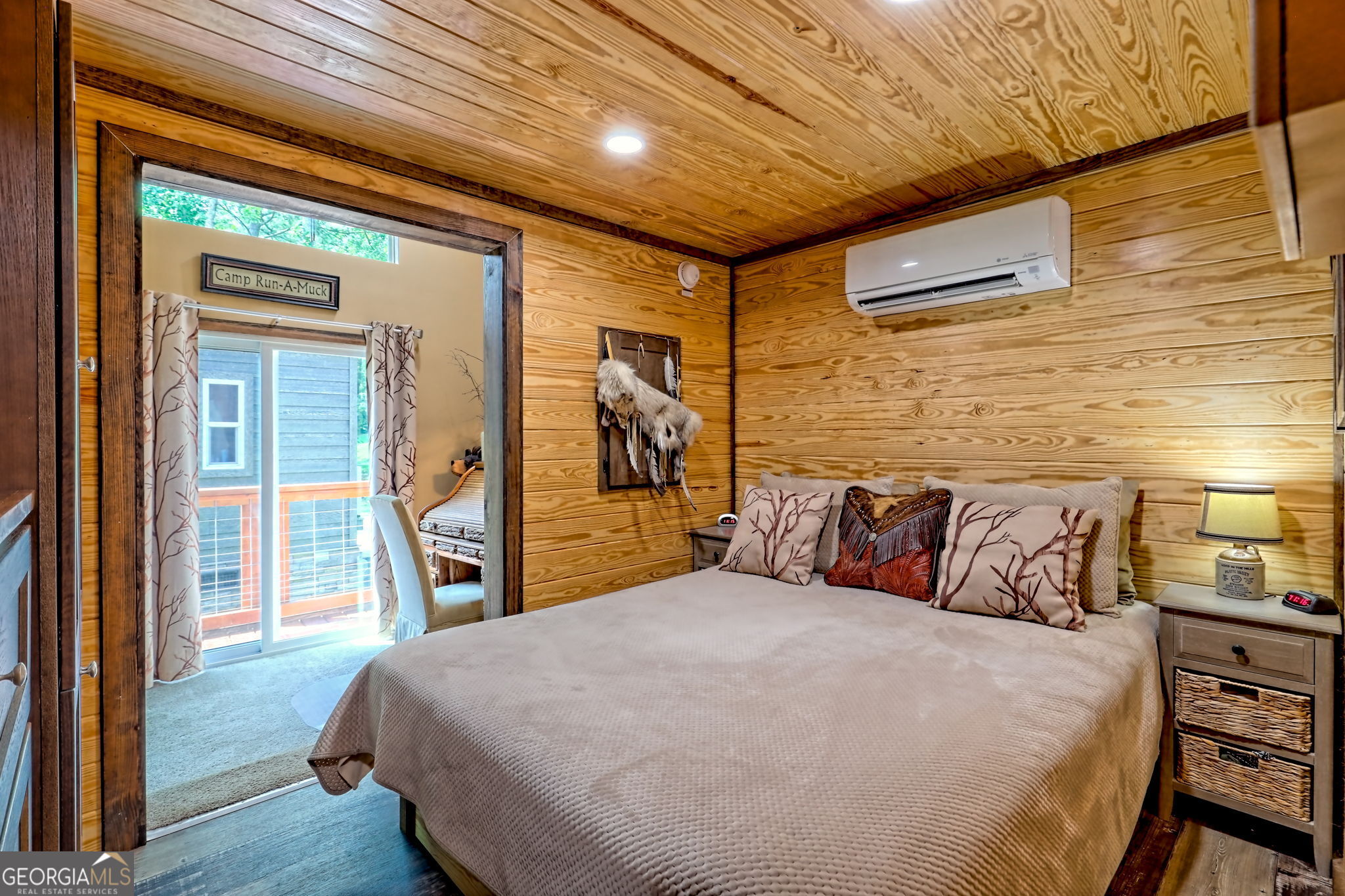 4960 Laurel Lodge Road, Unit 18 Clarkesville, GA 30523 - Photo 24 of 59 a bedroom with a large bed and a large window