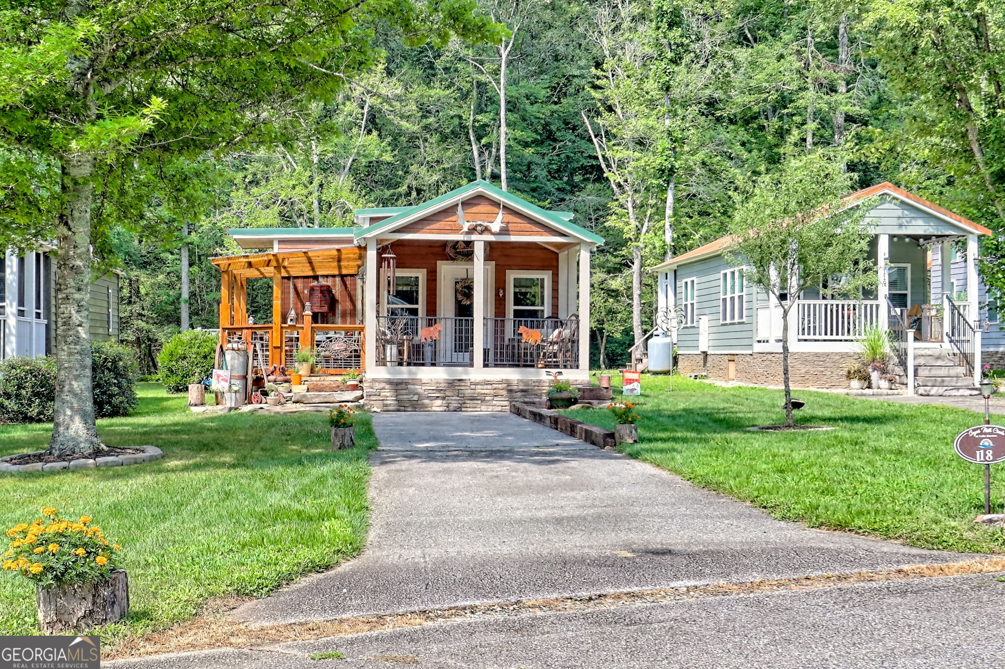4960 Laurel Lodge Road, Unit 18 Clarkesville, GA 30523 - Photo 3 of 59 a front view of a house with a yard