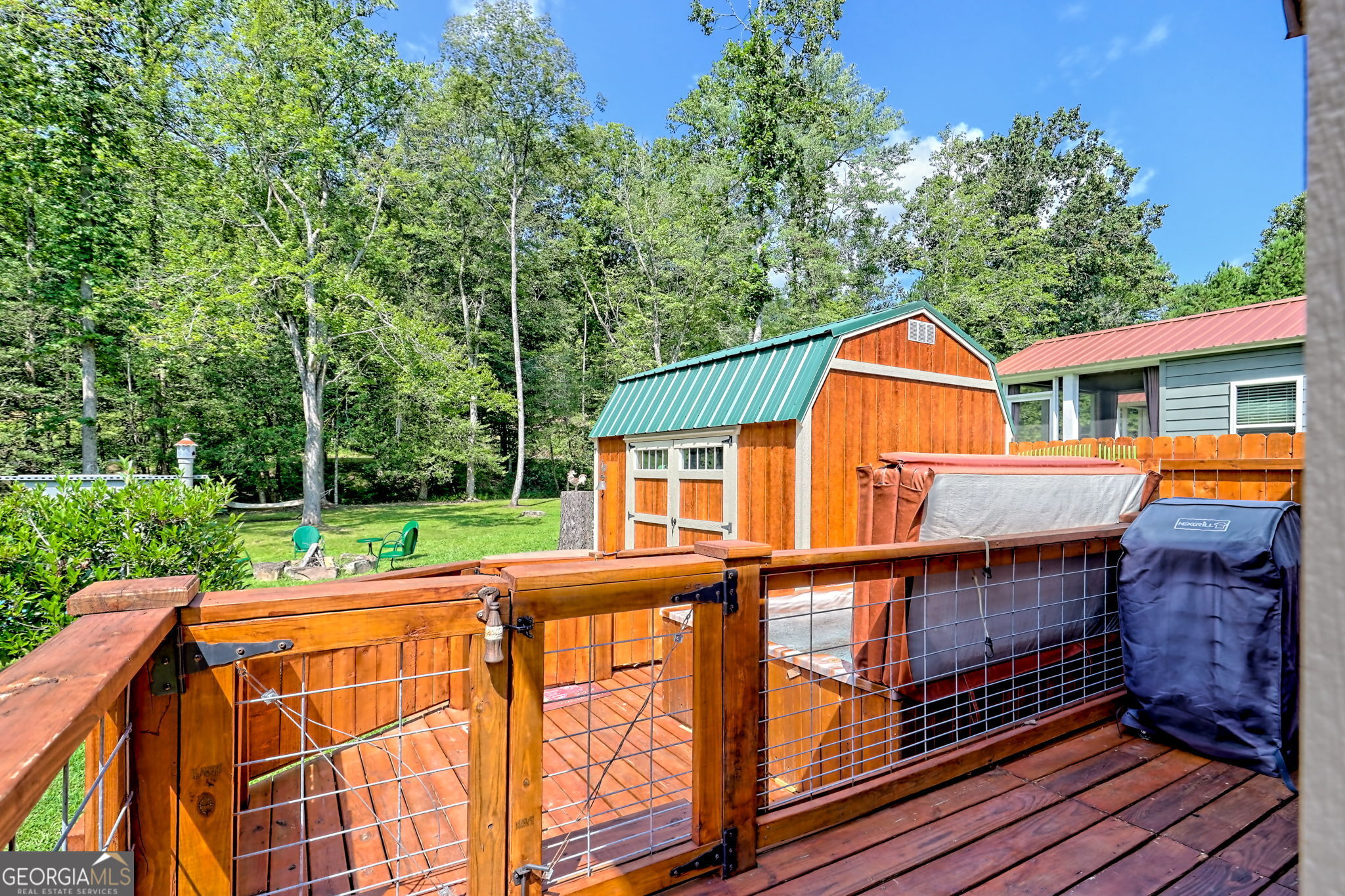 4960 Laurel Lodge Road, Unit 18 Clarkesville, GA 30523 - Photo 40 of 59 a view of a house with backyard and sitting area