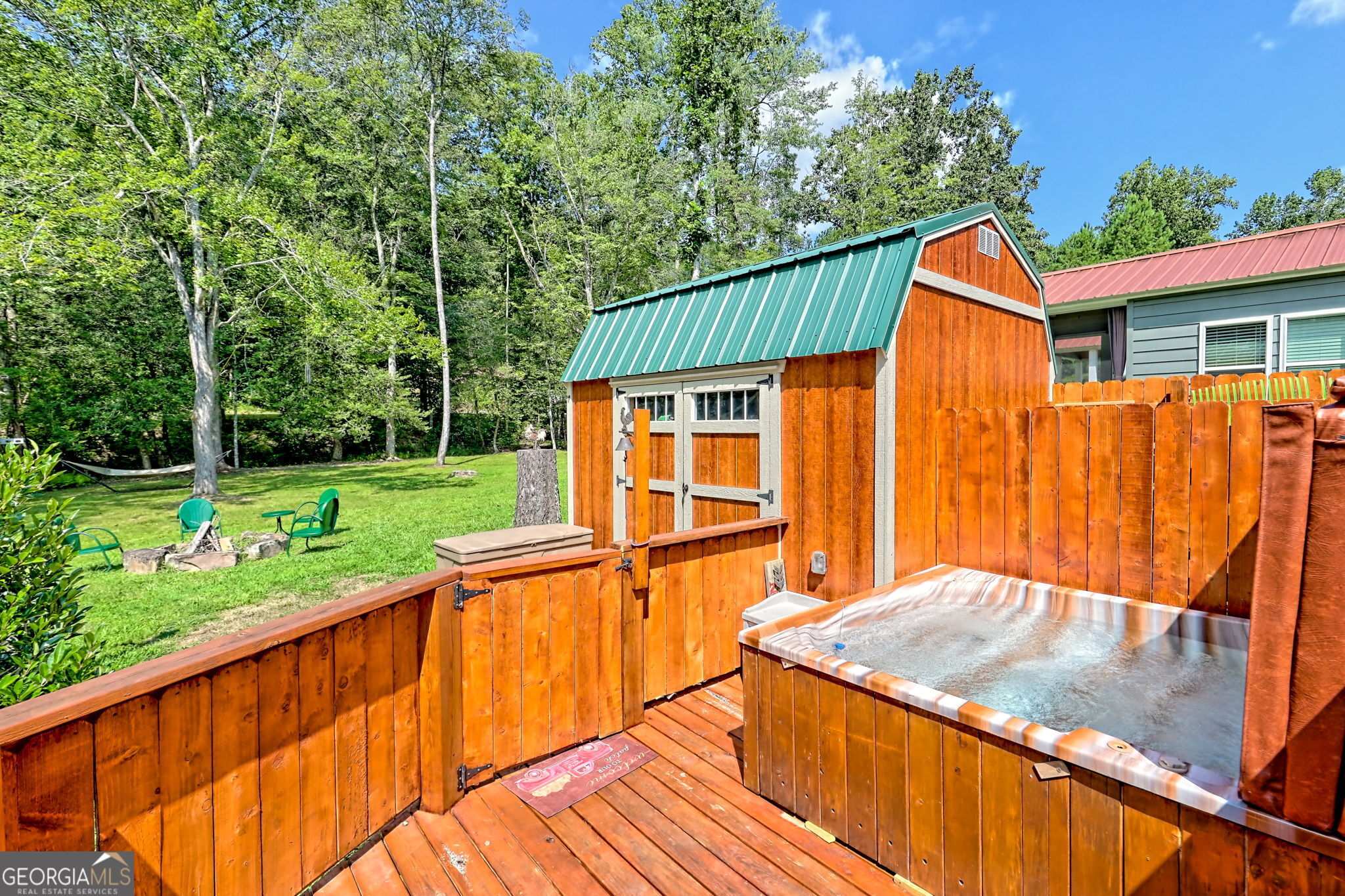 4960 Laurel Lodge Road, Unit 18 Clarkesville, GA 30523 - Photo 43 of 59 a view of a house with a backyard