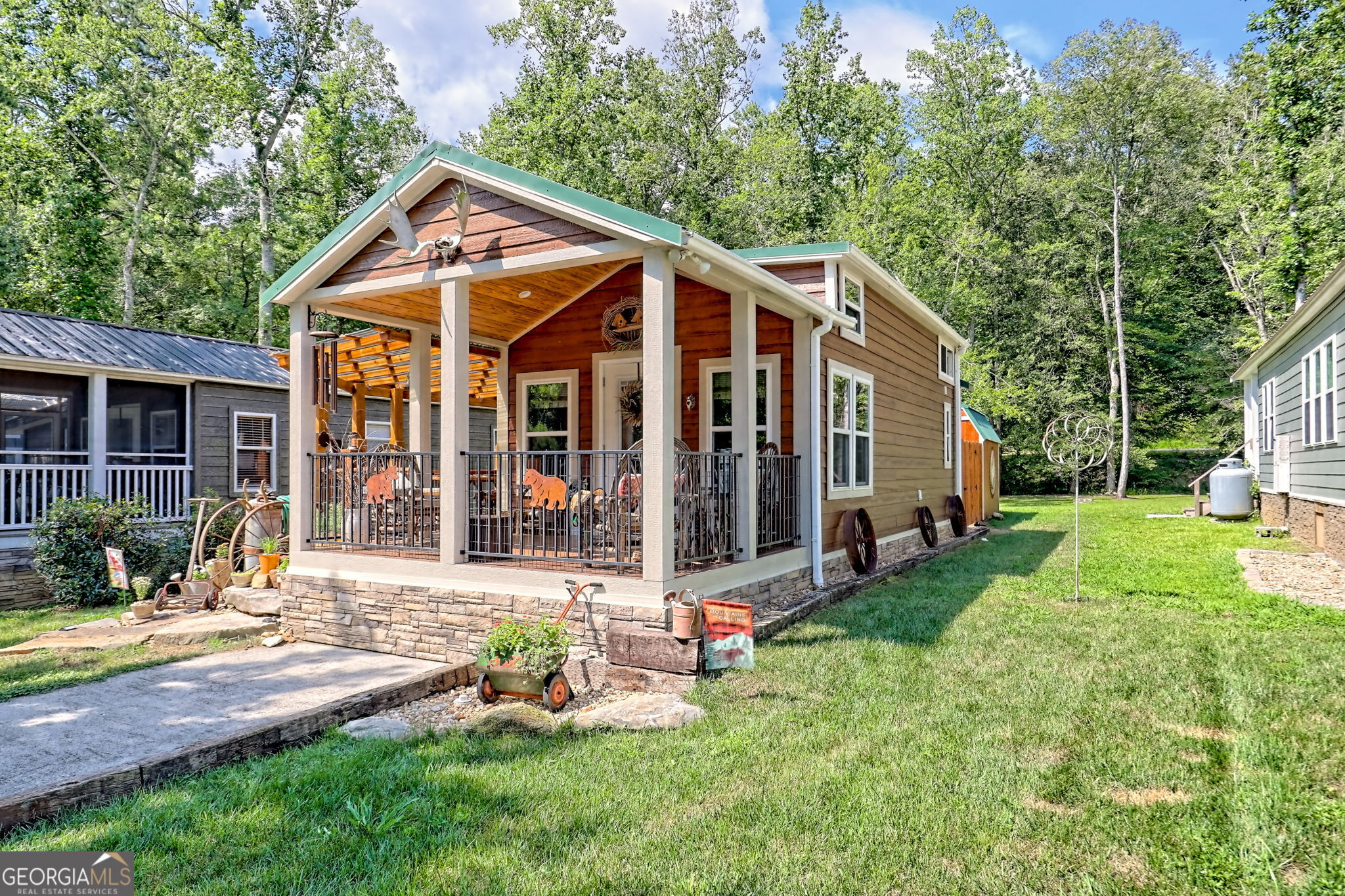 4960 Laurel Lodge Road, Unit 18 Clarkesville, GA 30523 - Photo 49 of 59 a view of a house with backyard porch and sitting area